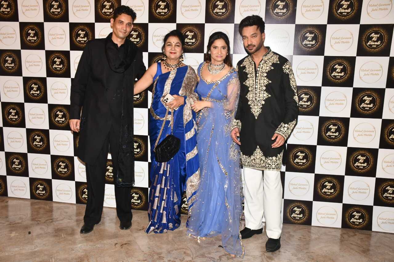 Ankita Lokhande and Vicky Jain hosted one of the most glamorous Diwali bash so far. The couple posed with Ankita's mom. While the actress looked gorgeous in a sheer lavender saree, Vicky complimented her in black and gold kurta set.